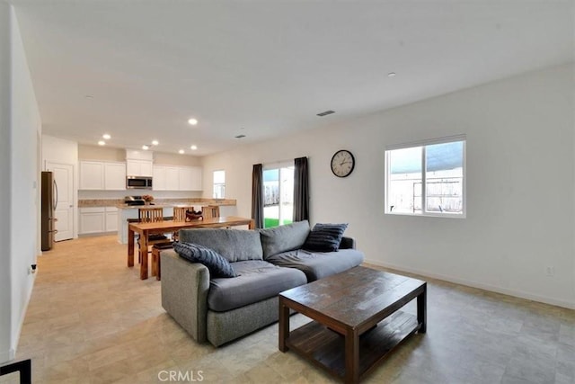 living room with plenty of natural light