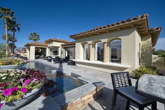 rear view of property with a patio area