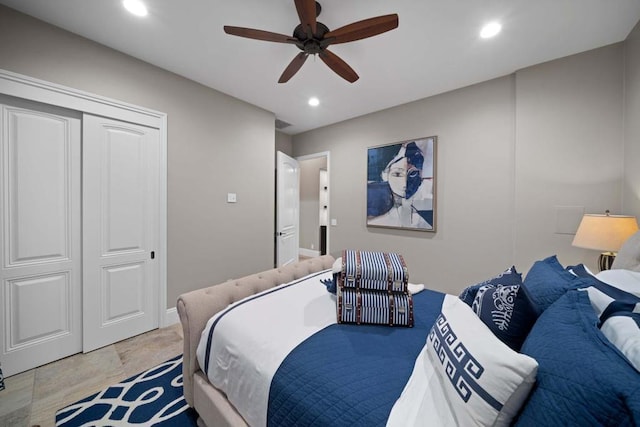 bedroom with ceiling fan and a closet