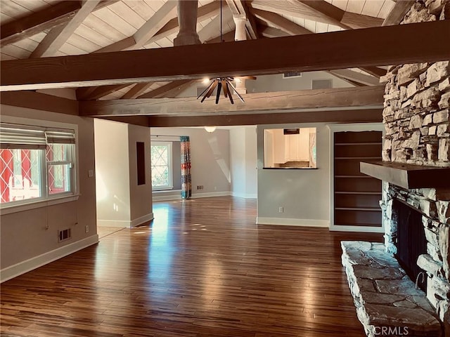 unfurnished living room with vaulted ceiling with beams, wood-type flooring, a fireplace, and wood ceiling