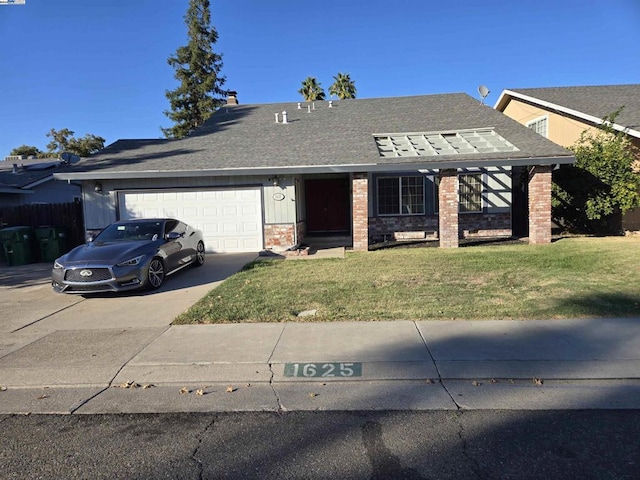 ranch-style house featuring a garage and a front lawn