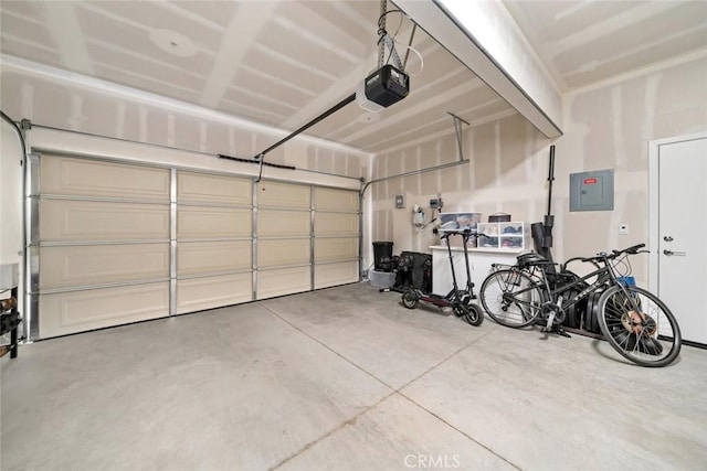 garage with electric panel and a garage door opener