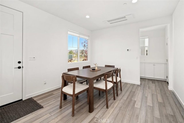 dining space featuring light hardwood / wood-style flooring