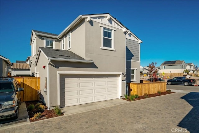 view of side of property featuring a garage