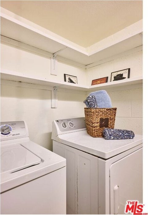 washroom with washing machine and dryer