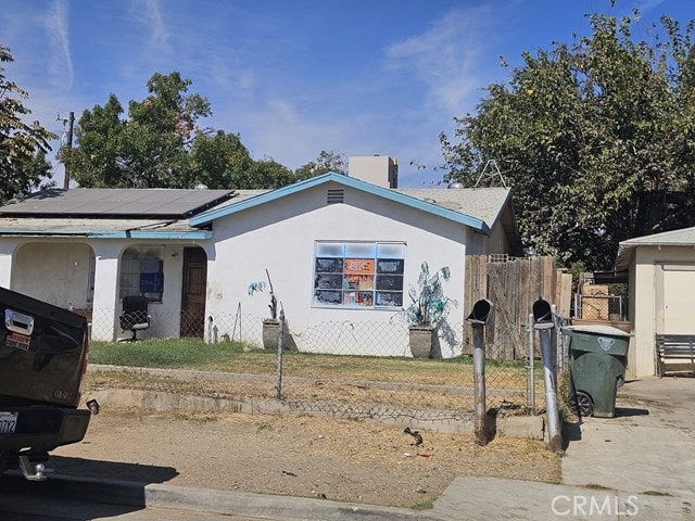 view of front of property with solar panels