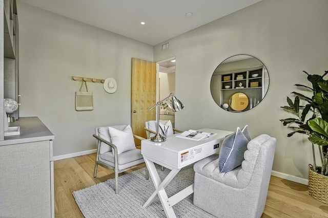 home office featuring light hardwood / wood-style floors