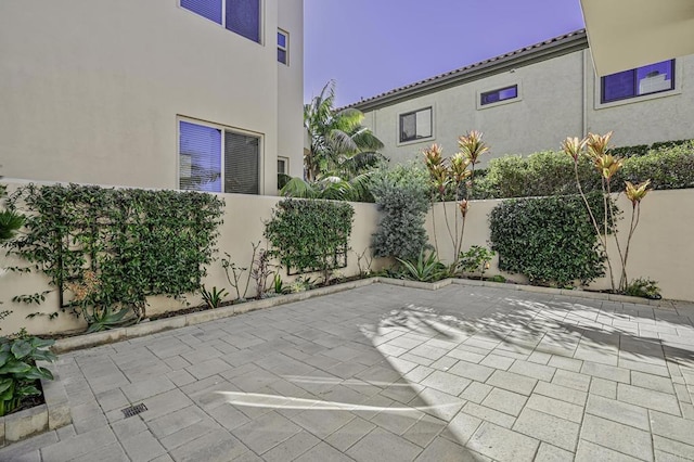 view of patio / terrace featuring fence