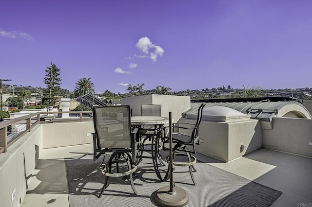 view of patio / terrace with outdoor dining space and a balcony