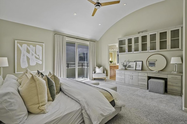 carpeted bedroom featuring built in desk, lofted ceiling, ensuite bathroom, ceiling fan, and access to outside