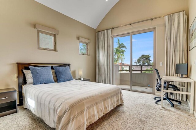 carpeted bedroom with access to outside and high vaulted ceiling