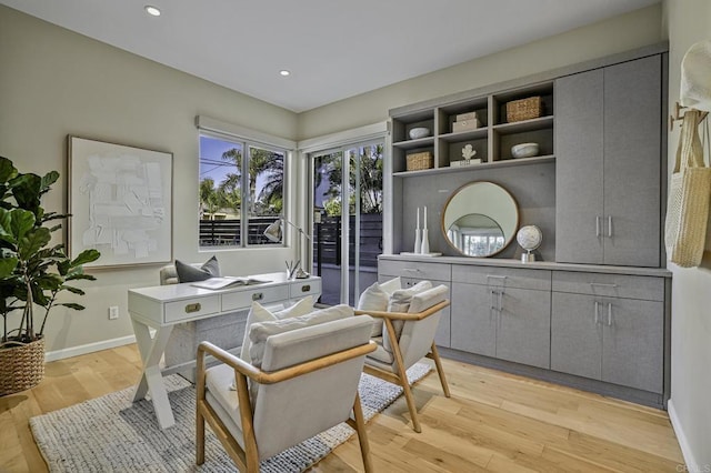 home office with light wood-style floors, baseboards, and recessed lighting