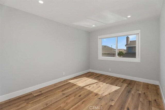 empty room featuring hardwood / wood-style flooring