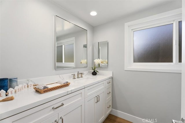 bathroom featuring hardwood / wood-style floors and vanity