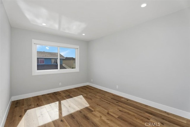 empty room featuring wood-type flooring