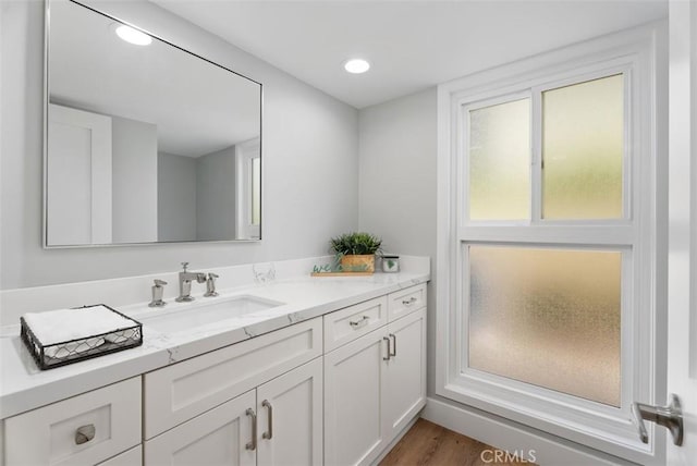 bathroom featuring vanity and hardwood / wood-style flooring