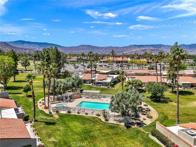 birds eye view of property with a mountain view