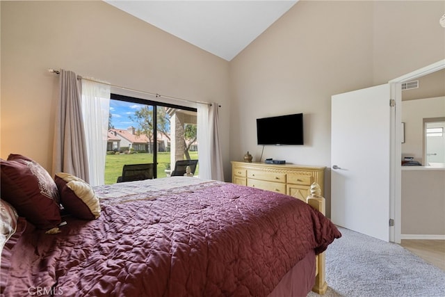 bedroom featuring access to outside and high vaulted ceiling