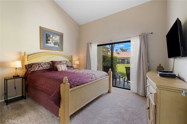 carpeted bedroom with access to outside and vaulted ceiling