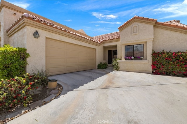 mediterranean / spanish-style house featuring a garage