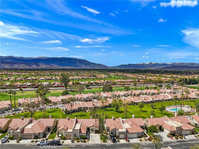 birds eye view of property with a mountain view