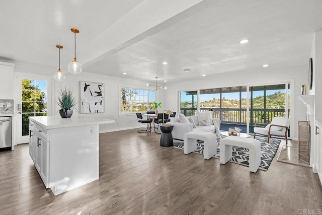 living room featuring dark hardwood / wood-style floors and a notable chandelier