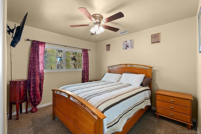 bedroom featuring dark carpet and ceiling fan