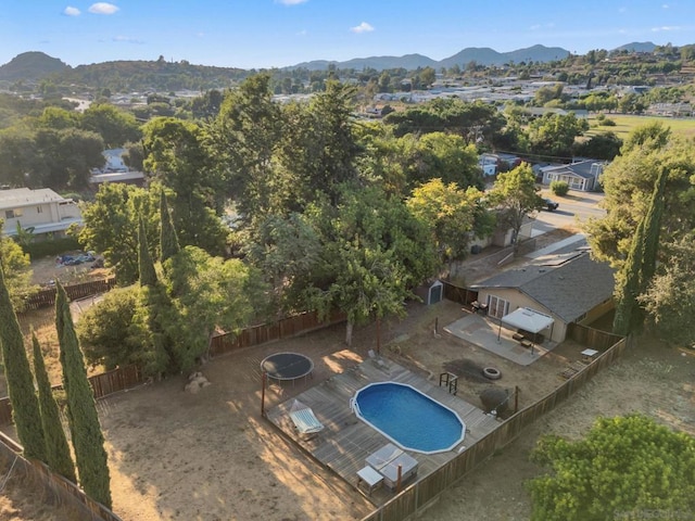 birds eye view of property featuring a mountain view