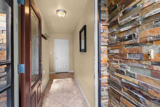 corridor featuring light tile patterned floors