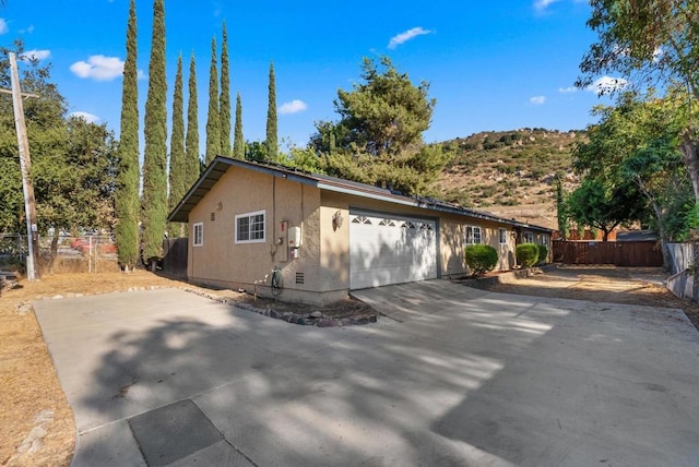 view of side of property with a garage