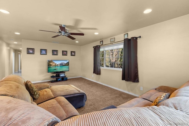 living room featuring carpet flooring and ceiling fan