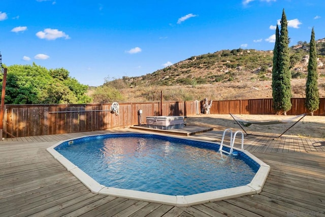 view of pool featuring a wooden deck