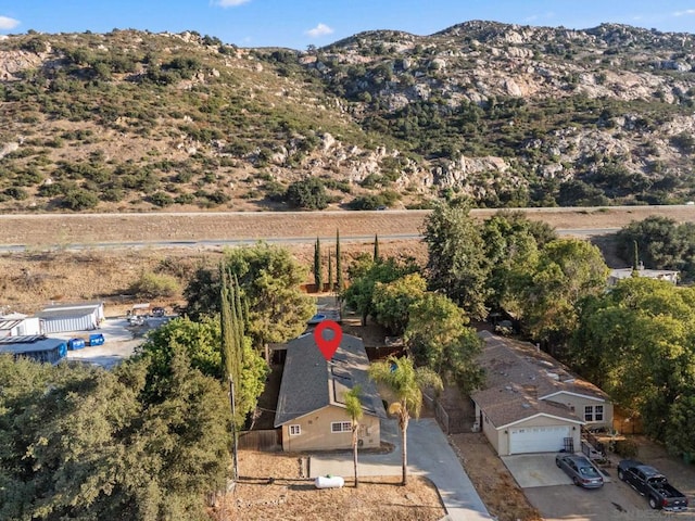 birds eye view of property featuring a mountain view