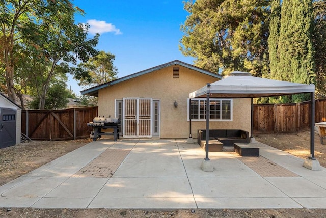 rear view of house featuring a patio