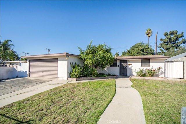 ranch-style house with a garage and a front yard