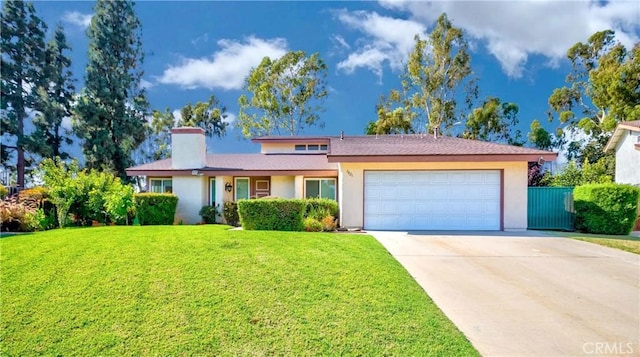 view of front facade with a garage and a front yard