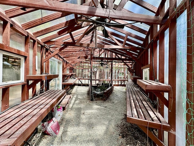 miscellaneous room with vaulted ceiling with beams