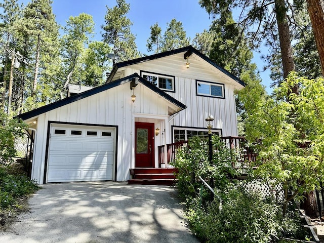 view of front of property with a deck and a garage