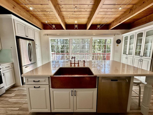 kitchen with white cabinetry, sink, wooden ceiling, and appliances with stainless steel finishes