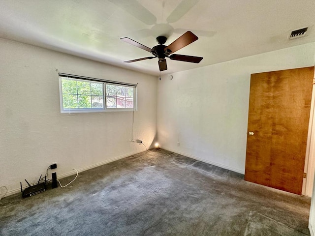 carpeted empty room with ceiling fan