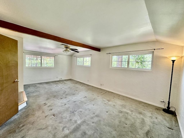 carpeted spare room with vaulted ceiling with beams and ceiling fan