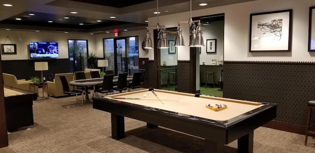 game room featuring carpet, pool table, and a tray ceiling