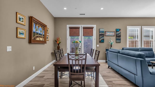 dining space featuring light wood-type flooring