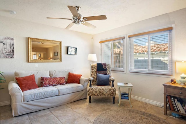 tiled living room featuring ceiling fan