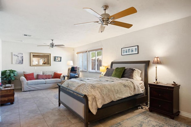 tiled bedroom featuring ceiling fan