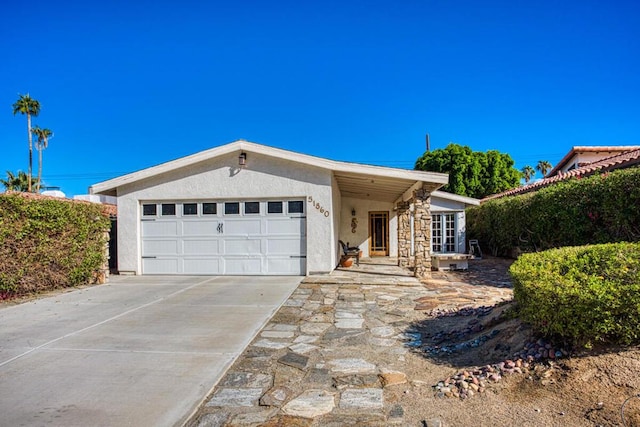 ranch-style home with a garage