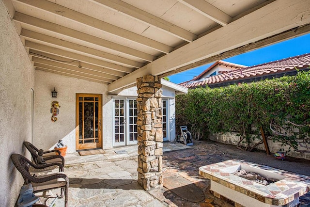 view of patio / terrace with a fire pit