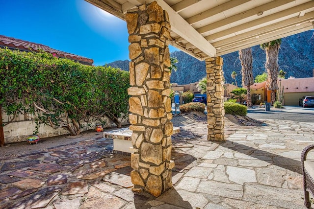 view of patio / terrace with a mountain view