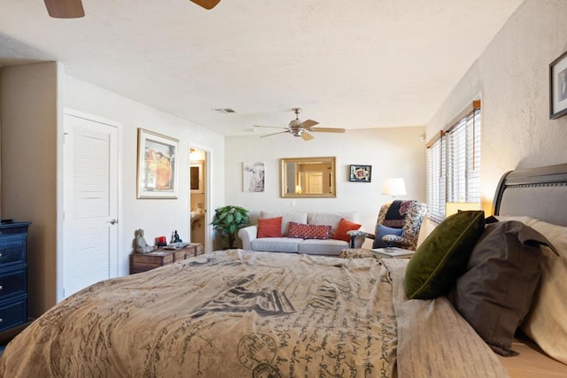 bedroom with ceiling fan and hardwood / wood-style flooring