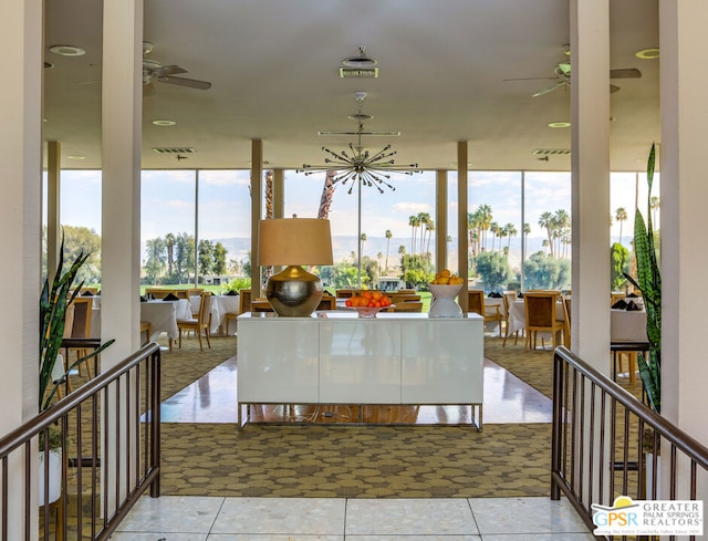 tiled dining room with ceiling fan